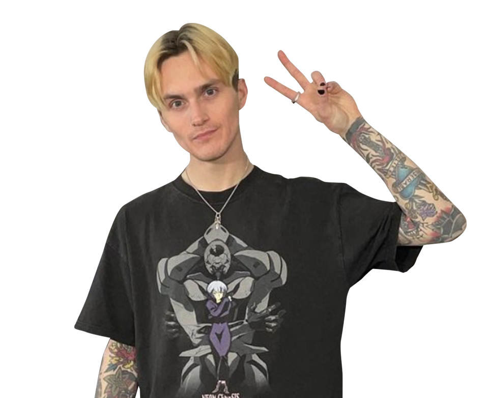 the author of the article, Jaxon Craig, in an Evangelion t-shirt making a peace sign with their hand